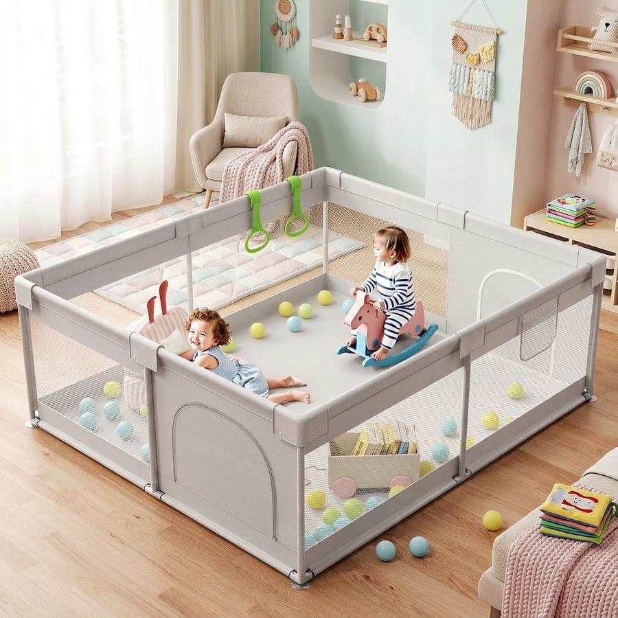 Three toddler cousins playing simultaneously inside a ZEEBABA 69x59 extra large playpen